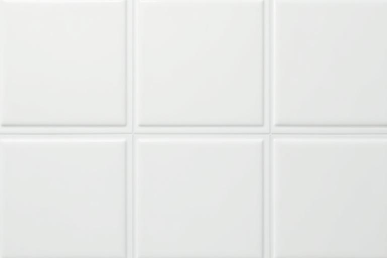 The same tile with bright, clean grout lines after restoration